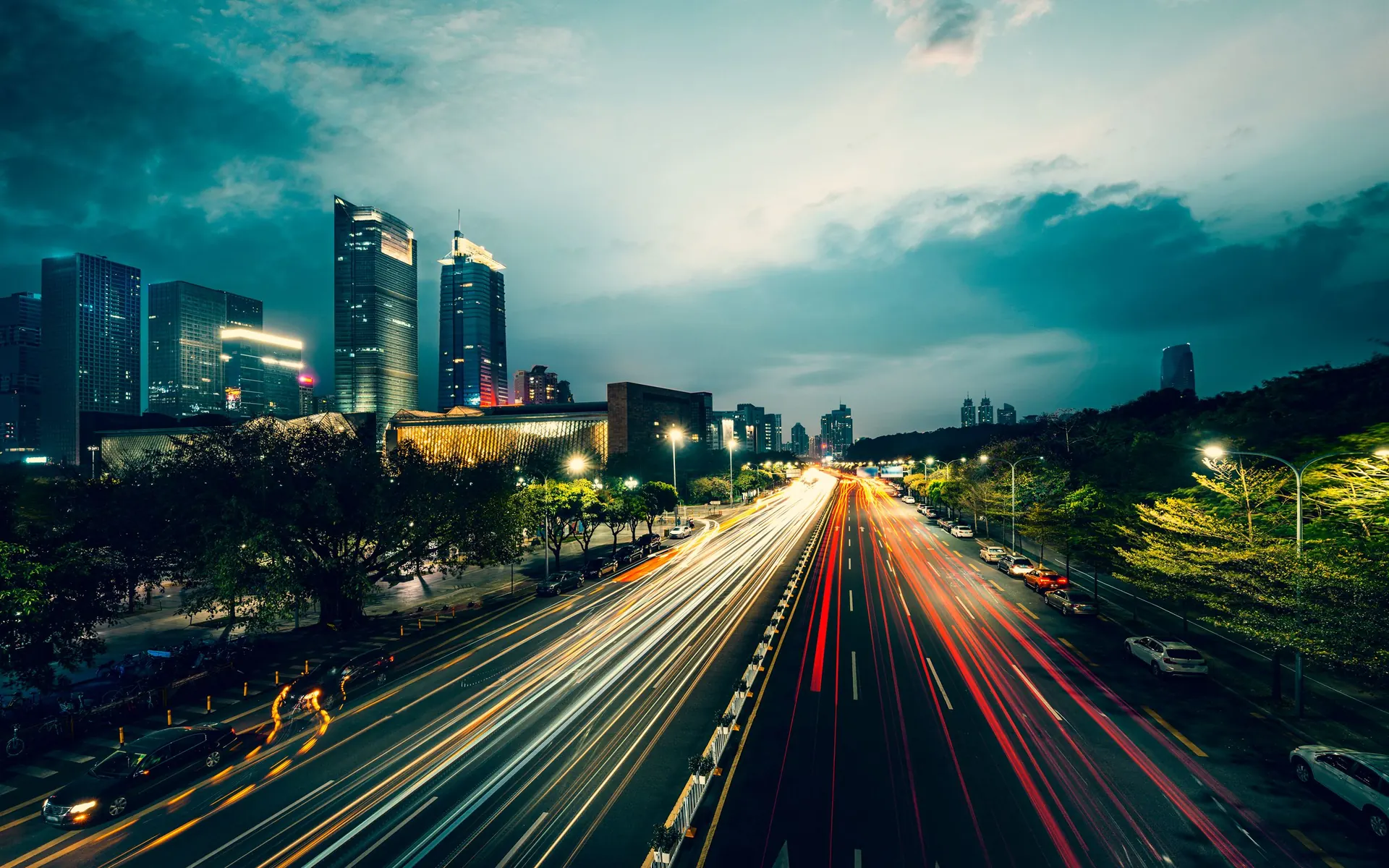 Light trails from traffic on a city boulevard at dusk