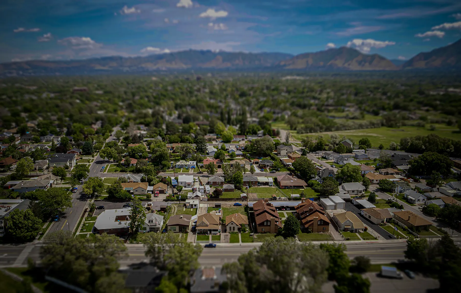 Aerial view of a neighborhood with mountains beyond